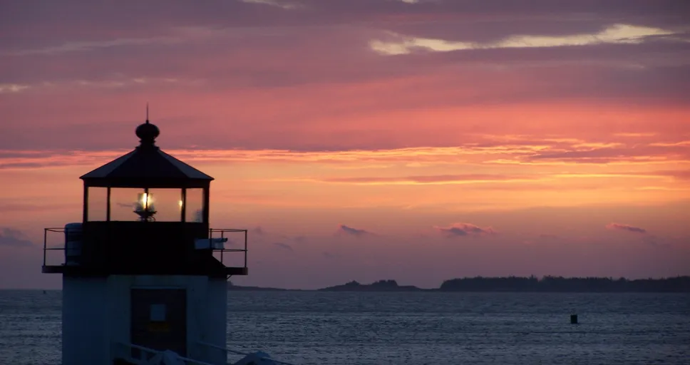 angel number 138 - sunset, water, lighthouse